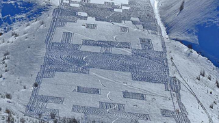 Snowy Space Invaders "crop circle" appears on a French hillside